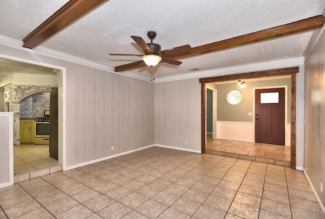 interior space with beam ceiling, ceiling fan, and a textured ceiling