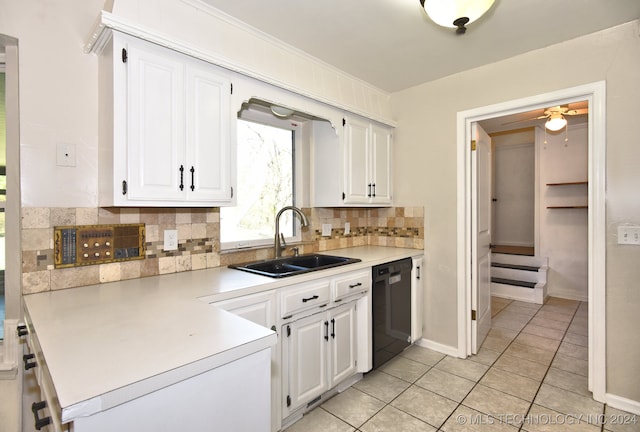 kitchen featuring white cabinets, decorative backsplash, black dishwasher, and sink