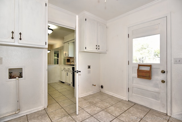 laundry room featuring electric dryer hookup, cabinets, washer hookup, light tile patterned floors, and ornamental molding