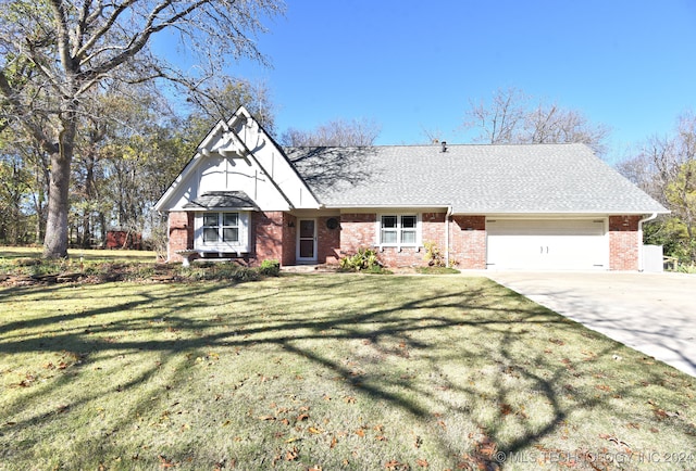 view of front of house featuring a garage and a front lawn