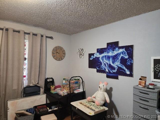 office space featuring a textured ceiling