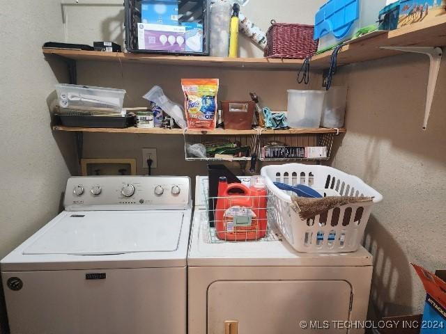 washroom with washer and dryer