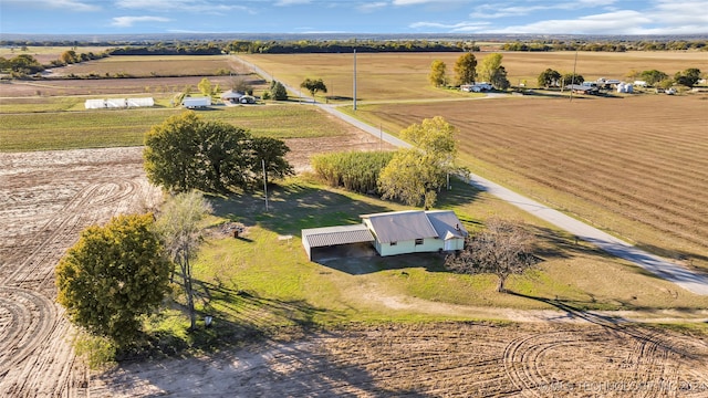 birds eye view of property with a rural view