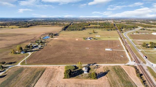 birds eye view of property with a rural view