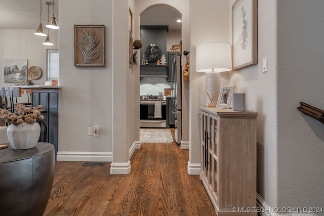 hallway featuring dark hardwood / wood-style floors