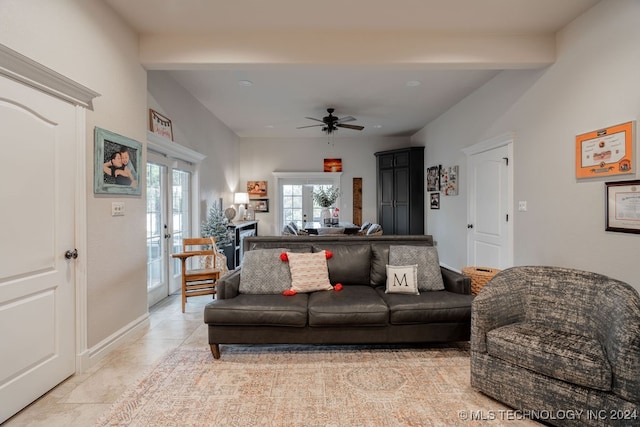 living room featuring beamed ceiling, french doors, and ceiling fan