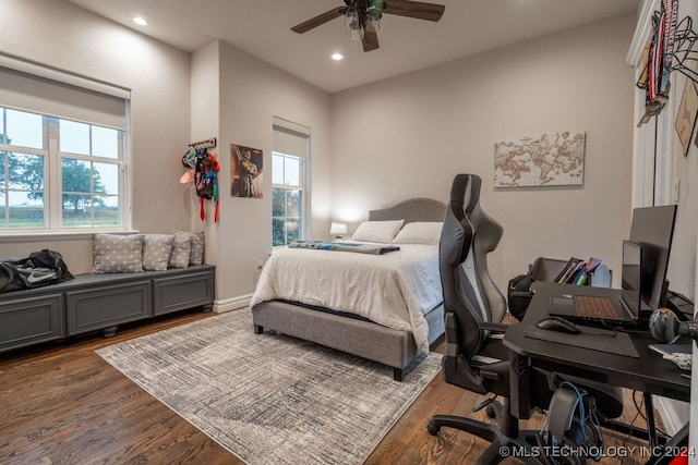 bedroom with ceiling fan and dark hardwood / wood-style flooring