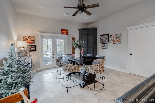 dining room featuring ceiling fan and french doors