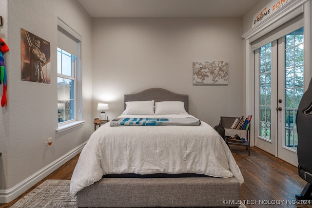 bedroom with access to exterior, french doors, and dark hardwood / wood-style floors