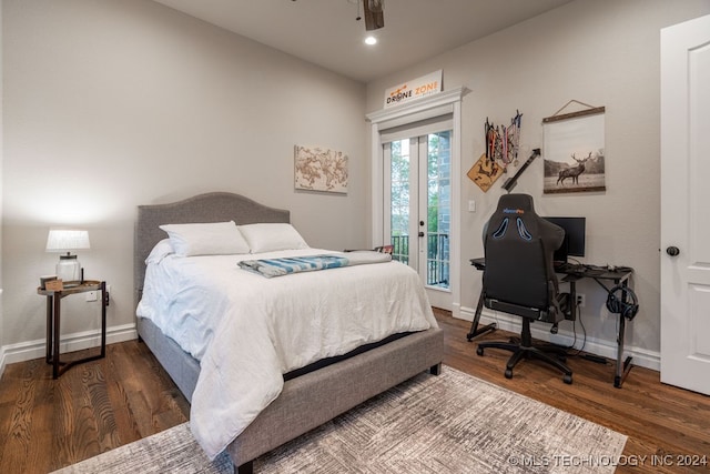 bedroom featuring dark hardwood / wood-style floors, ceiling fan, and access to outside