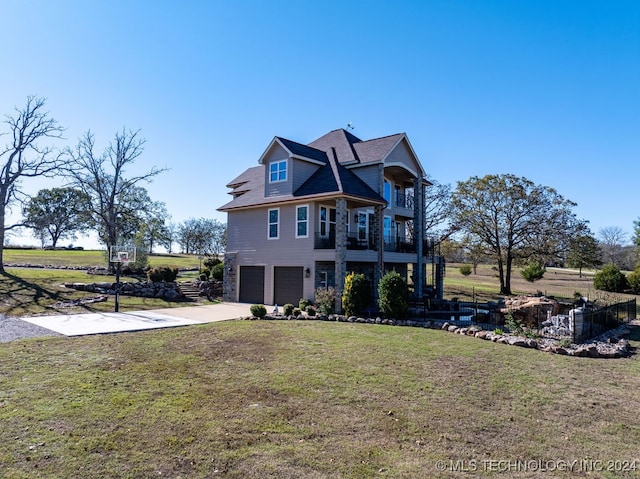 view of front of house with a front lawn and a garage