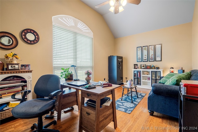 office area featuring hardwood / wood-style floors, ceiling fan, and lofted ceiling