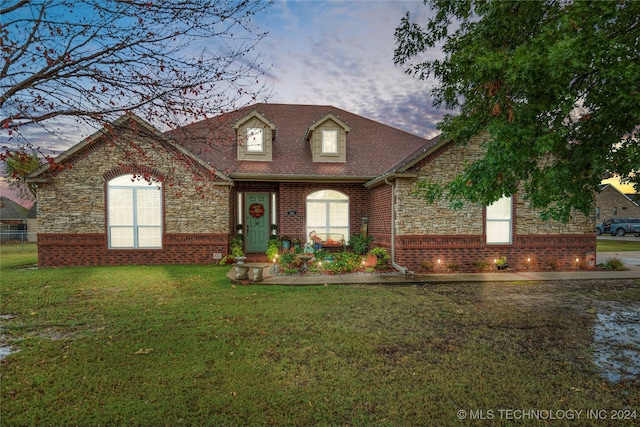 view of front of home with a yard