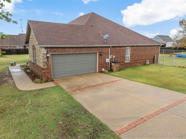 view of property exterior with a lawn and a garage