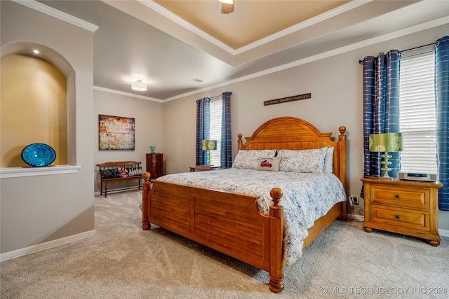 carpeted bedroom with ceiling fan and crown molding