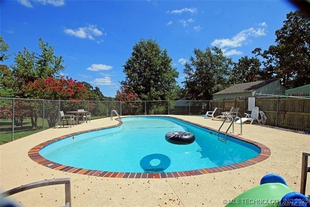 view of yard with basketball hoop