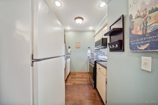 kitchen with white cabinetry, dark wood-type flooring, and stainless steel appliances