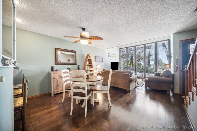 dining room featuring ceiling fan, a textured ceiling, and dark wood-type flooring