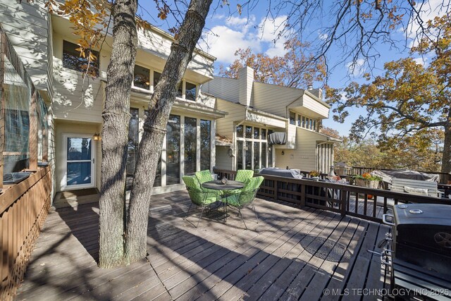 wooden deck with grilling area