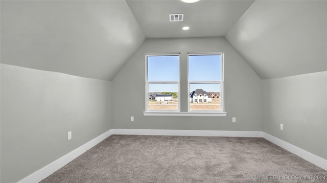 684 Chateau Bnd, Ardmore, OK 73401 - additional living space featuring carpet and vaulted ceiling