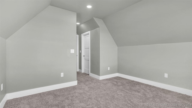 684 Chateau Bnd, Ardmore, OK 73401 - additional living space with lofted ceiling, carpet floors, and recessed lighting