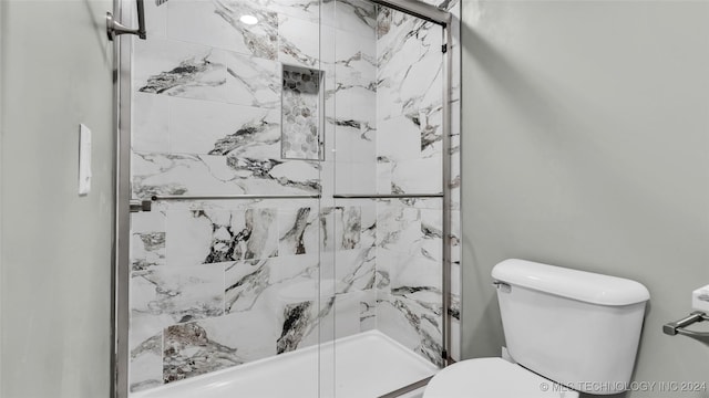 684 Chateau Bnd, Ardmore, OK 73401 - bathroom featuring a shower stall and toilet