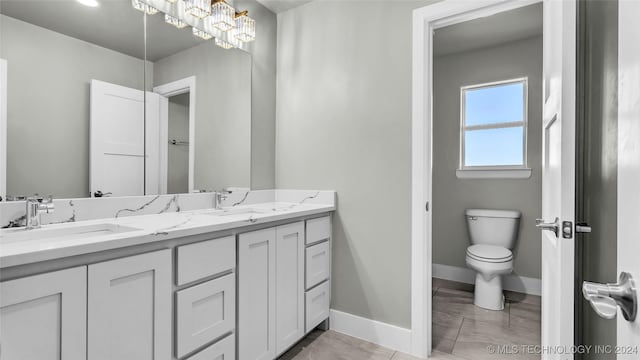 684 Chateau Bnd, Ardmore, OK 73401 - full bath featuring baseboards and double vanity