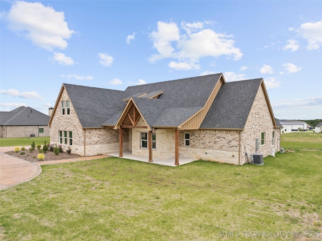 684 Chateau Bnd, Ardmore, OK 73401 - view of front of house with roof with shingles, a patio, a front lawn, and brick siding