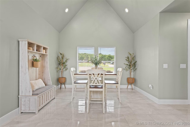 684 Chateau Bnd, Ardmore, OK 73401 - dining space featuring light marble finish flooring, high vaulted ceiling, and recessed lighting