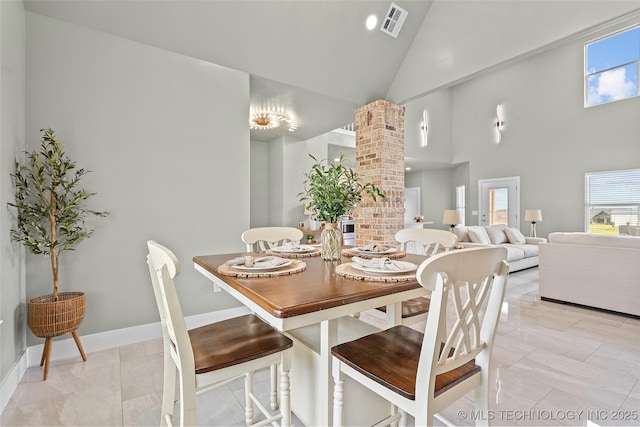 684 Chateau Bnd, Ardmore, OK 73401 - dining area with ornate columns, high vaulted ceiling, and healthy amount of natural light