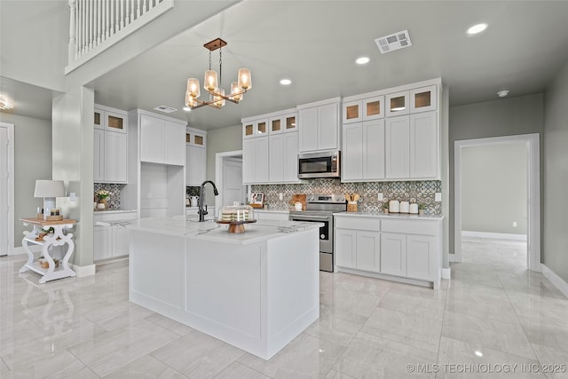 684 Chateau Bnd, Ardmore, OK 73401 - kitchen featuring stainless steel appliances, light marble finish floors, recessed lighting, decorative backsplash, and white cabinets