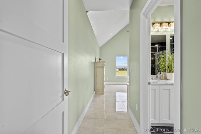 684 Chateau Bnd, Ardmore, OK 73401 - corridor featuring vaulted ceiling and light marble finish floors