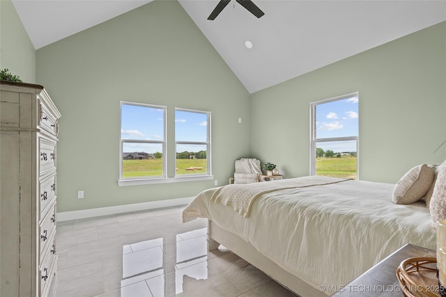 684 Chateau Bnd, Ardmore, OK 73401 - bedroom with high vaulted ceiling, ceiling fan, and light tile patterned flooring