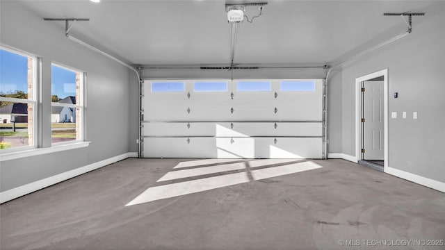 684 Chateau Bnd, Ardmore, OK 73401 - garage with a garage door opener and baseboards