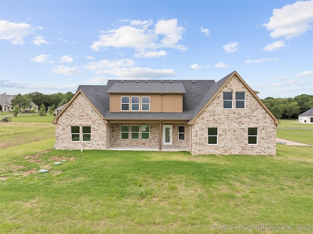 684 Chateau Bnd, Ardmore, OK 73401 - back of property with a patio, a yard, brick siding, and roof with shingles