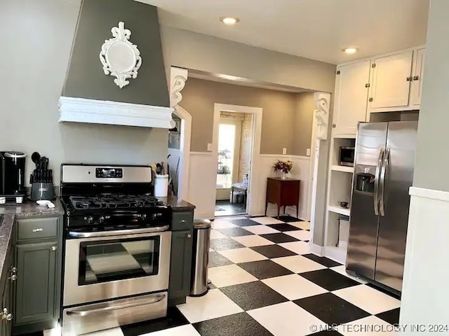 kitchen with appliances with stainless steel finishes and white cabinetry