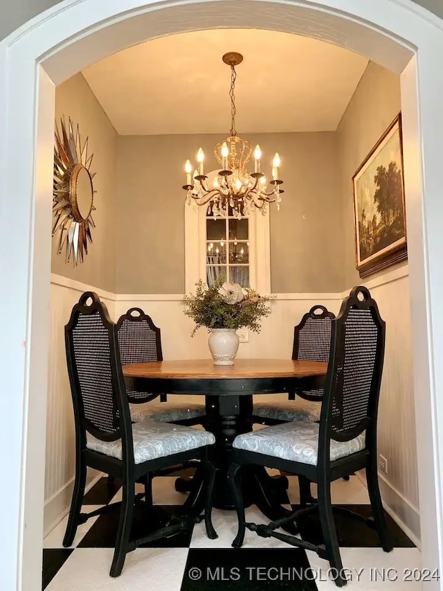 dining space featuring a chandelier