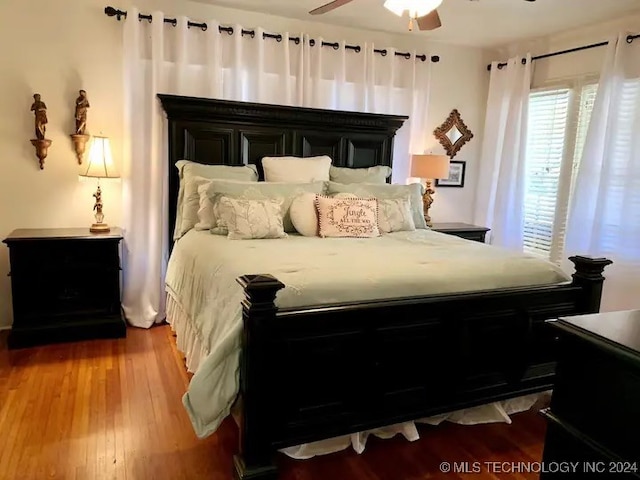 bedroom featuring hardwood / wood-style flooring and ceiling fan