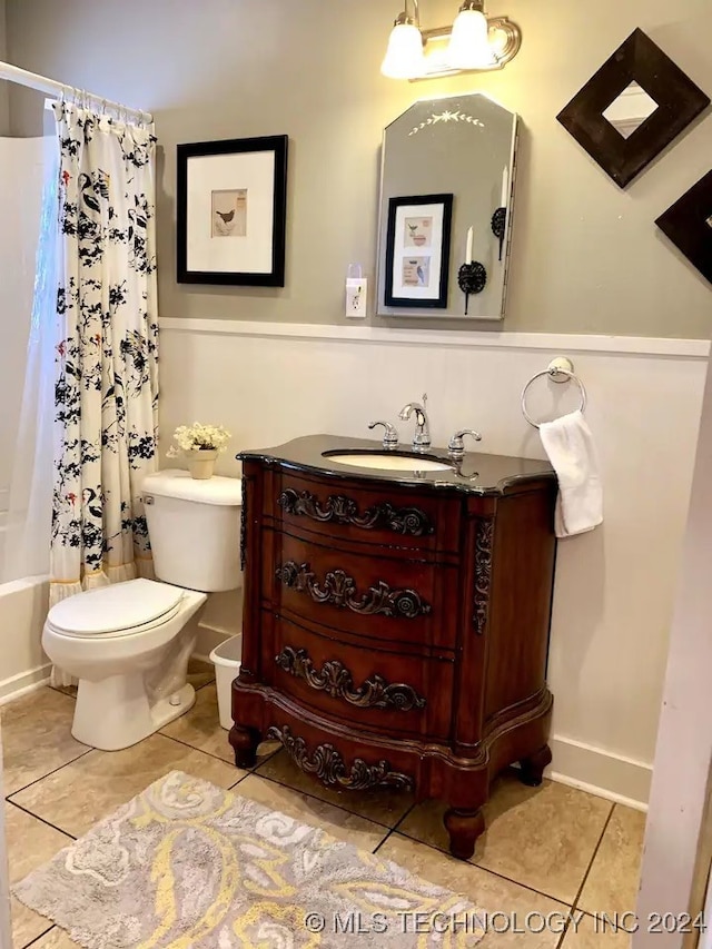 full bathroom with tile patterned flooring, vanity, toilet, and shower / bathtub combination with curtain