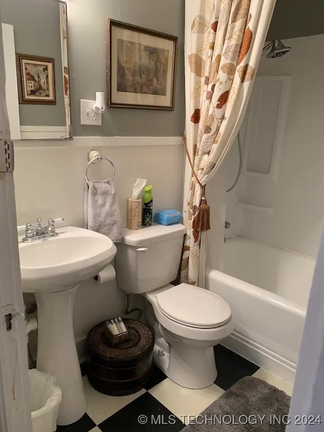 bathroom with shower / bath combination with curtain and toilet