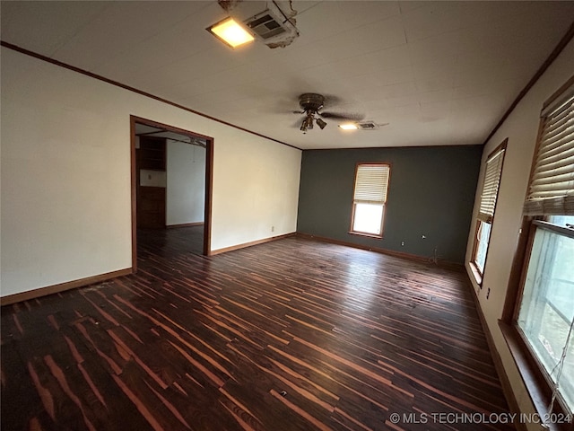 spare room with ceiling fan and dark wood-type flooring