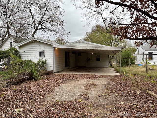 exterior space with a carport