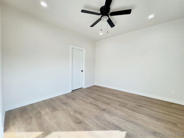 unfurnished room with a ceiling fan, baseboards, wood finished floors, and recessed lighting