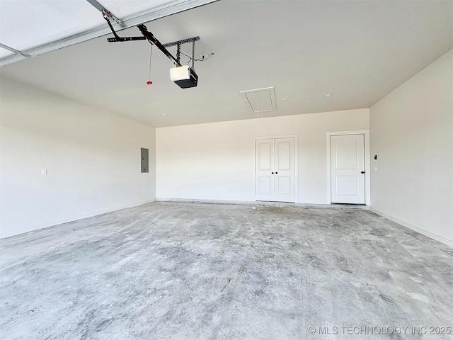 garage with electric panel and a garage door opener