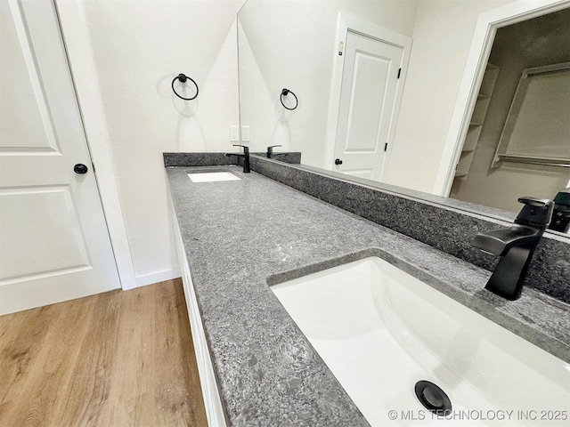 890 E Harlan Dr, Tahlequah, OK 74464 - full bathroom with double vanity, wood finished floors, and a sink