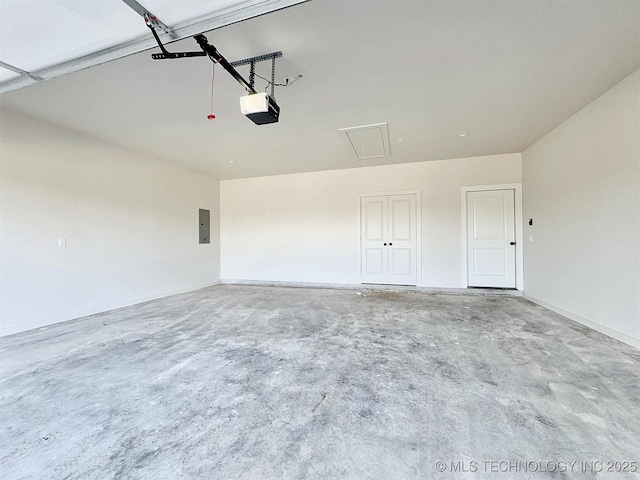 890 E Harlan Dr, Tahlequah, OK 74464 - garage featuring electric panel and a garage door opener