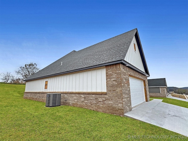 890 E Harlan Dr, Tahlequah, OK 74464 - view of home's exterior with driveway, brick siding, a shingled roof, central AC unit, and a lawn