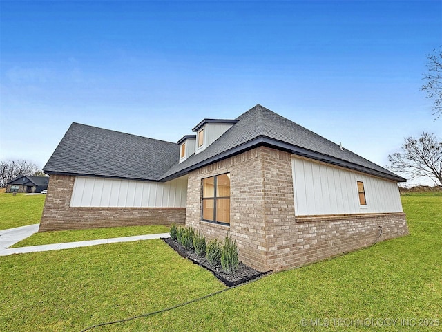 890 E Harlan Dr, Tahlequah, OK 74464 - view of property exterior featuring roof with shingles, brick siding, and a yard