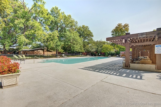 view of pool featuring a pergola and a patio