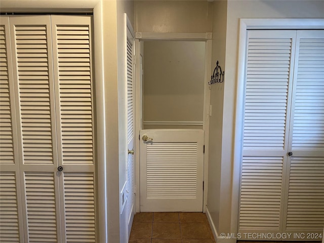 corridor featuring tile patterned floors